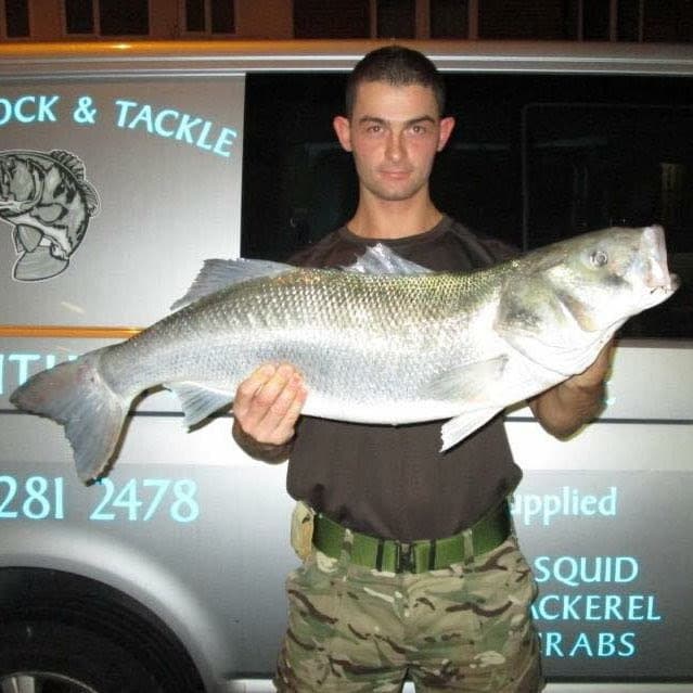John Locker holding a bass